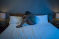 Young sad and depressed black afro American woman lying on bed at home unhappy and sleepless at night feeling overwhelmed Royalty Free Stock Photo
