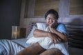 Young sad and depressed fat and chubby Asian girl feeling upset and desperate crying on bed at home victim of bullying and Royalty Free Stock Photo