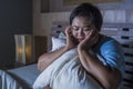 Young sad and depressed fat and chubby Asian girl feeling upset and desperate crying on bed at home victim of bullying and Royalty Free Stock Photo