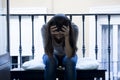 Desperate Latin woman sitting at home balcony looking destroyed and depressed suffering depression Royalty Free Stock Photo