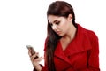 Young sad girl reading text message on her telephone Royalty Free Stock Photo