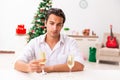 The young sad man christmas with champagne