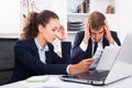 Young sad man and woman coworkers in firm office Royalty Free Stock Photo