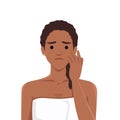 Young sad upset black woman character looking at mirror popping squeezing pimple at home Royalty Free Stock Photo