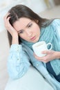 Young sad woman with cup coffee or tea Royalty Free Stock Photo