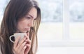 Young woman with cup of coffee or tea Royalty Free Stock Photo