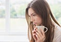 Young woman with cup of coffee or tea Royalty Free Stock Photo