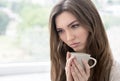 Young woman with cup of coffee or tea Royalty Free Stock Photo