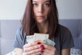 Young sad woman holding euro money in her hands. Economy and financial crisis. Saved money. Financial turmoil crisis Royalty Free Stock Photo