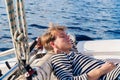 Young sailor dozing while calm