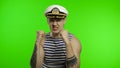 Young sailor man is angry and shows fists. Seaman guy in sailor`s vest Royalty Free Stock Photo