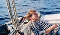 Young sailor resting while calm