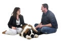 Young saint bernard and owners