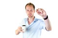 Young salesman holding cup and coffee beans