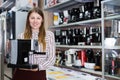 saleswoman suggesting coffee machine