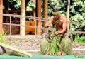 A young Samoan man demonstrating the art of weaving