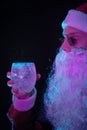 Young Santa Claus drinking tonic water