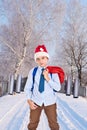 Young Santa Claus with a jetpack on his back holds gifts Royalty Free Stock Photo