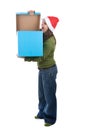 Young santa woman holding giant blue present box