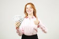 Attractive young businesswoman posing with bunch of USD cash in hands showing positive emotions and happy facial expression. Royalty Free Stock Photo