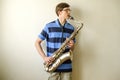 Young saxophonist plays tenor saxophone