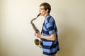 Young saxophonist plays tenor saxophone