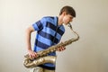 Young saxophonist plays tenor saxophone