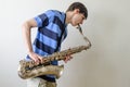 Young saxophonist plays tenor saxophone