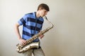 Young saxophonist plays tenor saxophone