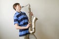 Young saxophonist plays tenor saxophone