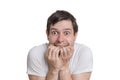 Young scared man isolated on white background Royalty Free Stock Photo