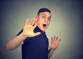 Scared man with shocked facial expression Royalty Free Stock Photo