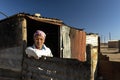 A young school girl alone in a squatter camp Royalty Free Stock Photo