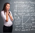 young school girl thinking about complex mathematical signs Royalty Free Stock Photo