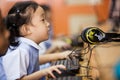 Young school kids start learning how to use a computer.