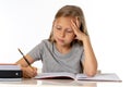 Young school student girl looking unhappy and tired in education concept Royalty Free Stock Photo