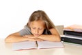 Young school student girl looking unhappy and tired in education concept Royalty Free Stock Photo