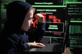 Young schoolboy prodigy - a hacker. Gifted student enters into the banking system. Royalty Free Stock Photo