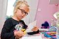 Young schoolgirl doing homework Royalty Free Stock Photo