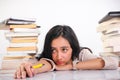 Young schoolgirl in drowsiness and exhaustion Royalty Free Stock Photo