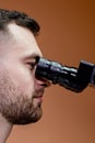 A young scientist conducting research with a microscope. Working with a microscope Royalty Free Stock Photo