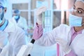 Young scientist holding test tubes with liquid samples on blurred background Royalty Free Stock Photo