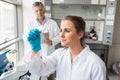 Young scientist looking at slide Royalty Free Stock Photo