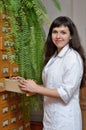 A young scientist near the file-cabinet