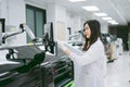 Young  scientist working with automation blood analyzer report in medical laboratory Royalty Free Stock Photo