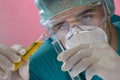 Young scientist working with mask