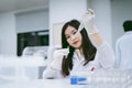 Young scientist working in medical laboratory , young female scientist using auto pipette to transfer sample Royalty Free Stock Photo