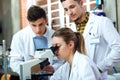 Young scientists carrying out an experiment in a laboratory. Royalty Free Stock Photo