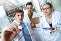 Young scientists carrying out an experiment in a laboratory. Royalty Free Stock Photo