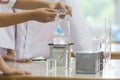 Young scientists are doing experiments in science labs.